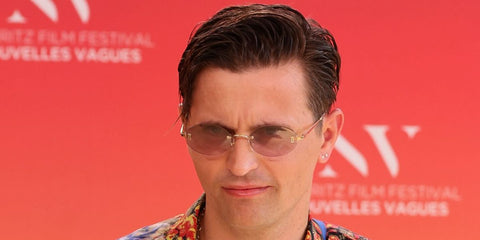 French actor Raphael Quenard was seen wearing gold Cartier CT0592S 003 rimless oval sunglasses at the Nouvelles Vagues Biarritz Film Festival 2026.