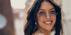German model and television host Rebecca Mir was seen wearing gold Miu Miu MU A54S 5AK04O rimless oval sunglasses with grey gradient lenses during Copenhagen Fashion Week, August 2025.