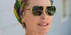 Model and actress Rebecca Romijn was seen wearing gold Bottega Veneta BV1012S 004 aviator sunglasses with green lenses in her Instagram post, August 2023.