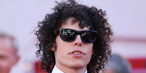 Digital creator Reece Feldman, widely known as Guy With A Movie Camera, was seen wearing black Saint Laurent Sun SL 815 Romy 001 sunglasses at the Karma screening during Cannes Film Festival 2026.