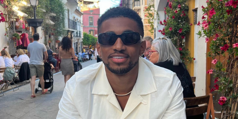 Footballer Reiss Nelson was seen wearing black Prada PR 17WS 1AB5S0 Symbole Sunglasses in his Instagram post, June 2022.