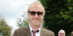 Actor Rhys Ifans was seen wearing black and transparent Ray-Ban Wayfarer RB 2140 1294/33 sunglasses with brown lenses