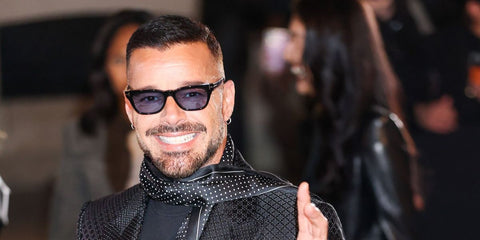 Ricky Martin was seen wearing black Tom Ford Penn-02 TF1362 05A sunglasses with blue lenses at the Tom Ford Fall/Winter 2026 fashion show during Paris Fashion Week.