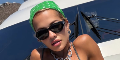 Rita Ora was seen wearing black Saint Laurent SL 736 001 sunglasses in Mykonos, shared through her Instagram post in July 2026.