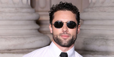Canadian actor Robbie G.K. was seen wearing silver Saint Laurent SL 799 002 oval sunglasses at the Saint Laurent Menswear Fall/Winter 2026 fashion show during Paris Men's Fashion Week