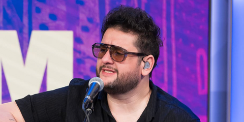 Mexican musical artist Roman Torres was seen wearing transparent grey Tom Ford Rosco TF1022 20E sunglasses with yellow Photochromic lenses as he visited SiriusXM Studios in Miami, February 2026.