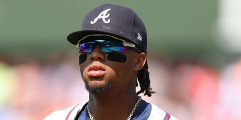 Baseball player Ronald Acuna Jr. was seen wearing white Oakley Radar EV Path OO9208 73 sunglasses with Prizm sapphire lenses in Chicago, Illinois, May 2024