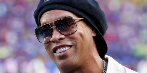 Brazilian football star Ronaldinho was seen wearing black and gold Dita Mach Five DRX 2087 A aviator sunglasses at the FIFA World Cup 2026.
