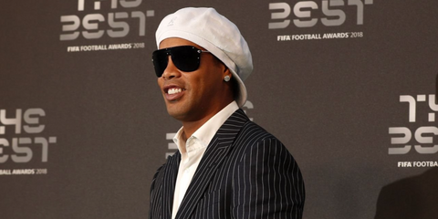 Brazilian former footballer Ronaldinho was seen wearing black Versace 2180 1000/87 sunglasses at The Best FIFA Football Awards 2018 in London. Shop online now on Pretavoir