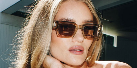 Rosie Huntington-Whiteley wears Saint Laurent Sun SL 572 003 beige crystal sunglasses.