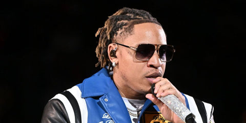 Singer and actor Rotimi was seen wearing gold and striped red Carrera 1055/S W3J9K aviator sunglasses onstage during halftime at the between the Philadelphia 76ers and the Atlanta Hawks in Atlanta, March 2025. Shop online now on Pretavoir