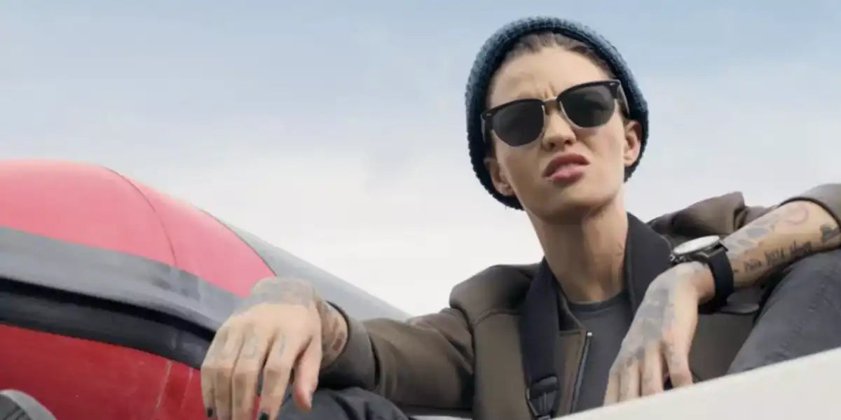 Australian model Ruby Rose was seen wearing the iconic Ray-Ban Clubmaster 3016 W0365 Black half-rim sunglasses in 2006 movie "Troubled Waters"