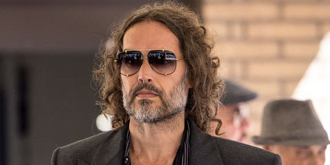 Russell Brand was seen wearing black and gold Dita Talon 23007 A aviator sunglasses with grey gradient lenses in May 2025. Shop online now on Pretavoir