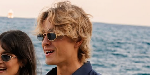 Model and influencer Ryan Prevedel was seen wearing gold Persol 1028S 1132/56 sunglasses with light blue lenses at a Persol event in Liguria, Italy, June 2026.