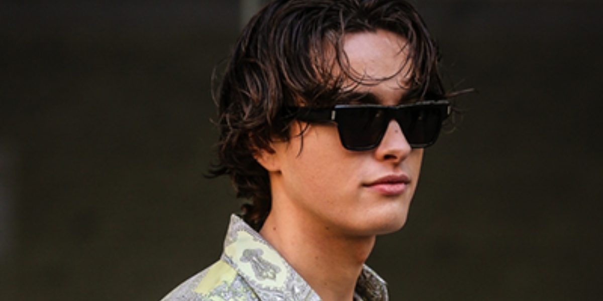 Ryan Prevedel was seen wearing Saint Laurent Sun SL 469 001 sunglasses to attend Etro Fall/Winter 2022 fashion show during Milan Men's Fashion Week