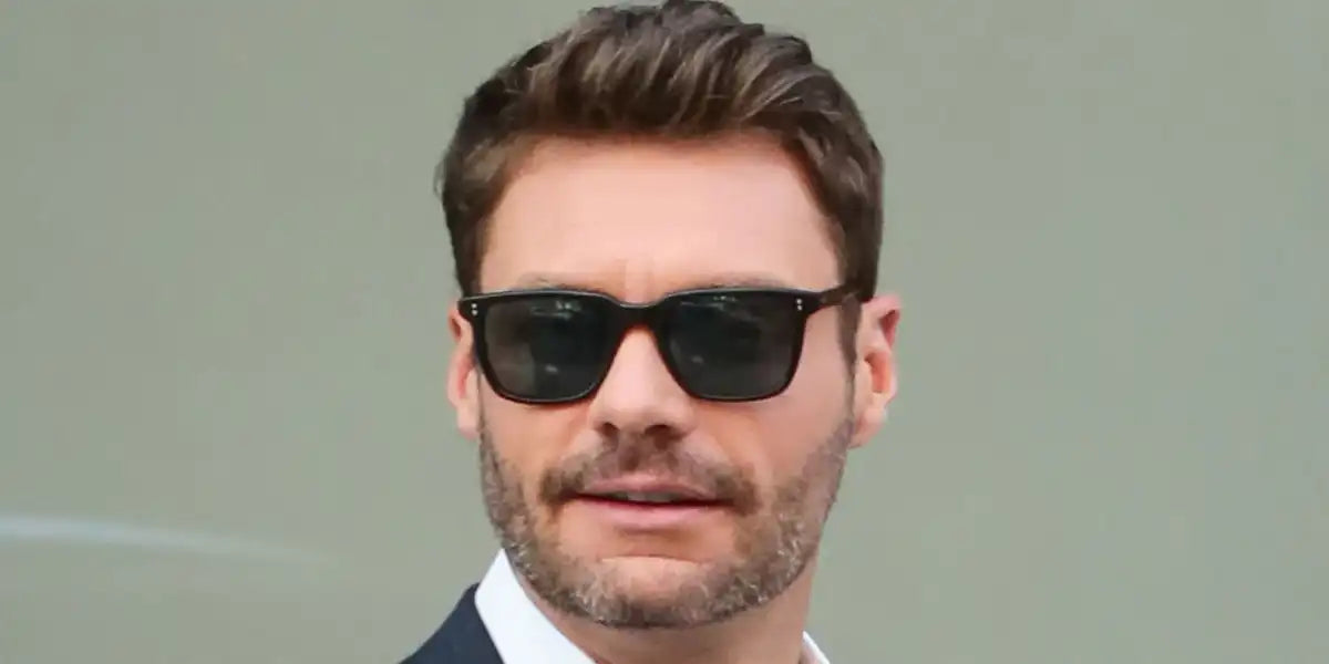 Ryan Seacrest was seen wearing black Oliver Peoples Lachman Sun OV5419SU 1005/P2 Polarised in an Elle USA feature