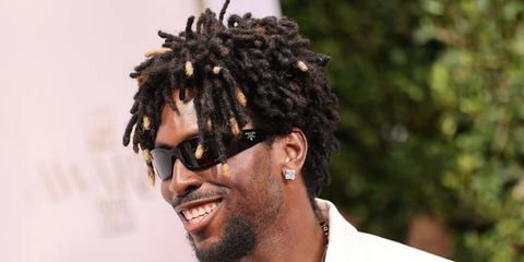 Guyanese-American SAINt JHN was seen wearing black Prada PR A14S 1AB5S0 wraparound sunglasses at the 2025 BET Awards in Los Angeles, June 2025. Shop online now on Pretavoir