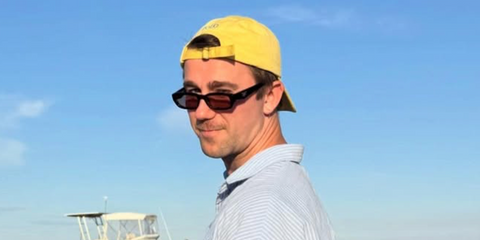 Music producer SG Lewis was seen wearing black Prada PR B06S 16K40J sunglasses with violet lenses in his Instagram post, November 2025.