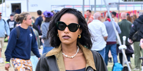 British actress Saffron Hocking was seen wearing black Loewe Anagram LW40127I 01A cat eye sunglasses at Glastonbury Festival 2024