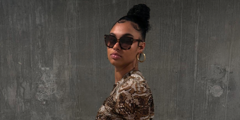 Basketball player Satou Sabally was seen wearing brown tortoiseshell Prada PR 23ZS 07R0A6 sunglasses with brown gradient lenses in her Instagram post, September 2025. Shop online now on Pretavoir