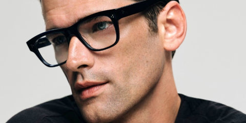 Sean O'Pry is seen wearing Oliver Peoples Birell OV5524U 1492 square glasses in the brand's Fall/Winter 2023 campaign