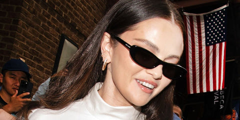 Selena Gomez was seen wearing black Saint Laurent Sun SL 557 Shade 001 sunglasses in New York City, September 2026.