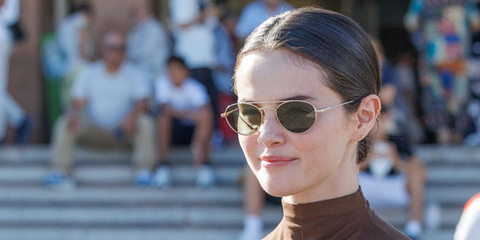 Selena Gomez was seen wearing gold Saint Laurent Sun SL 97 004 sunglasses with green lenses in Venice, August 2026.