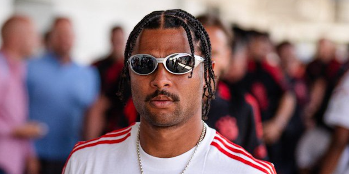 German footballer Serge Gnabry of Bayern Munich F.C. was seen wearing silver Oakley Eye Jacket Redux OO9438 05 Prizm Polarised sunglasses in 2022.