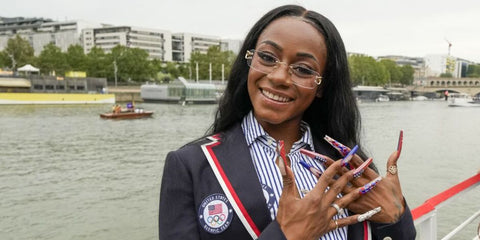 Sha'Carri Richardson is seen wearing Cartier Piccadilly CT0092O 001 'Big C' glasses to the Paris Olympics