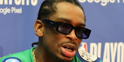 Basketball player Shai Gilgeous-Alexander wearing black Prada sunglasses