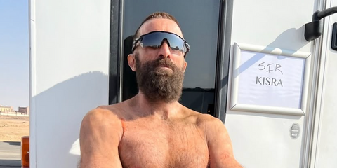 Sharlto Copley was seen wearing black Oakley Radar EV Path OO9208 52 Prizm sunglasses on the set of Dessert Warrior in Saudi Arabia, shared through his Instagram post in December 2025.