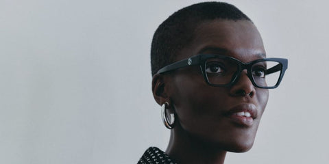 Model and actress Sheila Atim was seen wearing black Giorgio Armani AR7285HU 5875 optical glasses in the Giorgio Armani's "Crossroad Story" feature.