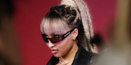 Jamaican singer Shenseea wre black Balenciaga BB0041S 001 wraparound sunglasses at the 2026 iHeartRadio Music Festival.