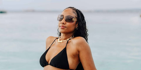 Influencer Sherlina Nym was seen wearing gold Miu Miu Rimless Runway MU 54YS 5AK06I sunglasses with light purple lenses in her Instagram post, August 2025. Shop online now on Pretavoir