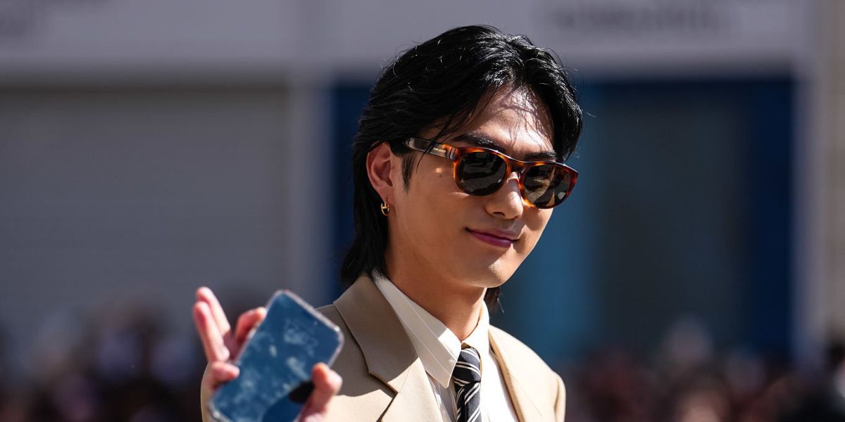 Japanese model Shuzo Ohira was seen wearing tortoiseshell Saint Laurent SL 798 Maxime 003 sunglasses at the Saint Laurent Menswear SpringSummer 2026 fashion show during Paris Men's Fashion Week