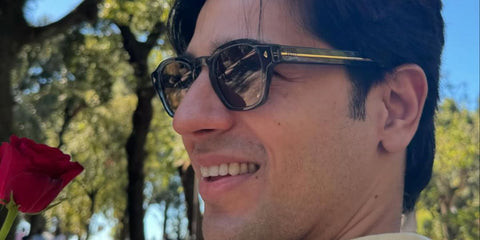 Bollywood actor Sidharth Malhotra was seen wearing black Prada PR A16S 16K04D Polarised sunglasses in his wife Kiara Advani's Instagram post