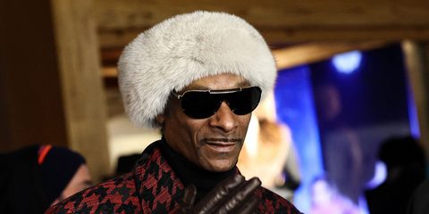 Snoop Dogg, rapper and honorary coach for US team, was seen wearing black and gold Versace 2140 1002/87 sunglasses at the Milano Cortina Winter Olympics 2026.