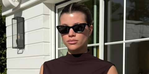 Sofia Richie was seen wearing black Ray-Ban Lady Burbank RB 2299 901/31 sunglasses in her Instagram post, December 2025.