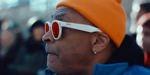 Spike Lee was seen wearing white Oakley Meta Hstn OW8002 04 Prizm Smart Glasses in the Oakley Super Bowl 2026 commercial