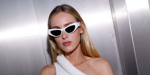 Italian DJ Stella Bossi was seen wearing white Dolce&Gabbana DG4450 3312/87 sunglasses at the 20 Years TUSH Magazine Party in Berlin, July 2025.