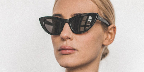 Italian DJ Stella Bossi was seen wearing black Saint Laurent Sun SL 213 001 Lily cat eye sunglasses.