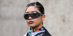 Digital creator Steph Hui was seen wearing grey Miu Miu MU B14SU 25N70M Ivresse shield sunglasses at the Miu Miu Fall/Winter 2026 fashion show during Paris Fashion Week.