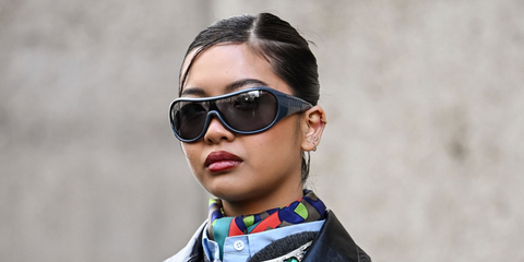 Digital creator Steph Hui was seen wearing grey Miu Miu MU B14SU 25N70M Ivresse shield sunglasses at the Miu Miu Fall/Winter 2026 fashion show during Paris Fashion Week.