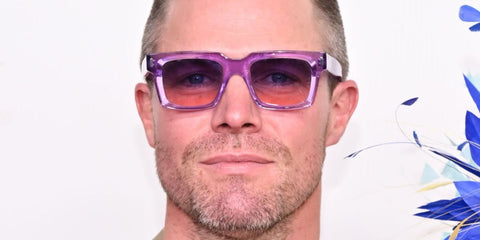 Canadian actor Stephen Amell was seen wearing transparent pink purple Cutler and Gross Sun Colour Studio CGSN 1386 06 sunglasses at the Kentucky Derby 150 in May 2024.