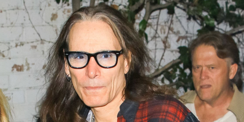 American guitarist Steve Vai was seen wearing shiny black Ray-Ban Wayfarer Ease RB 4340V 2000 optical glasses in Los Angeles, November 2019.