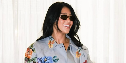 Olympic gymnast Suni Lee was seen wearing gold Prada PR A60S 5AK70G rectangulat sunglasses during New York Fashion Week season Spring/Summer 2025