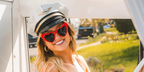 Sydney Thomas was seen wearing red Saint Laurent Sun SL 181 LouLou 002 heart shaped sunglasses in her Instagram post, May 2025.