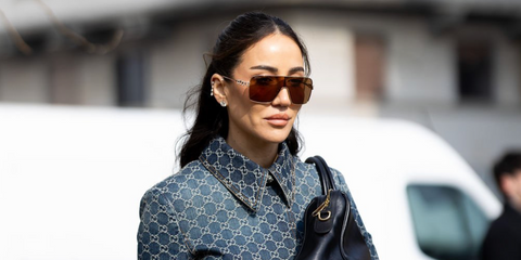 Tamara Kalinic was seen wearing gold Gucci GG1936S 003 shield sunglasses with brown lenses and crystallised Gucci logo details at the Gucci Fall/Winter 2026 fashion show during Milan Fashion Week.