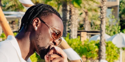 Footballer Tammy Abraham of Aston Villa FC was seen wearing gold Cartier CT0468S 004 rimless sunglasses with brown lenses at this engagement celebration in Los Cabos, Mexico, shared through his Instagram post in June 2025.