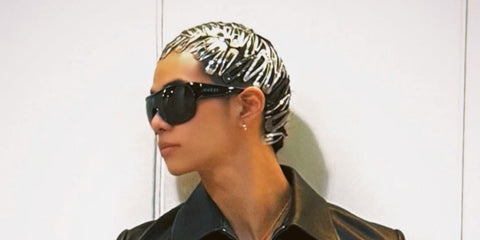 South Korean rapper Tarzzan of AllDay Project was seen wearing black Gucci GG2175SA 001 Asian Fit shield sunglasses in his Instagram post, January 2026.